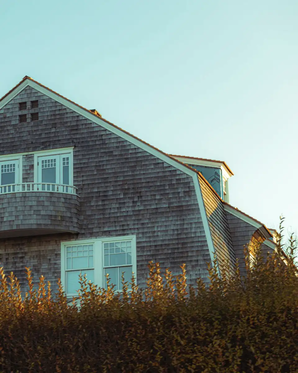 Weathered cedar shingle siding and roof on a gabled house