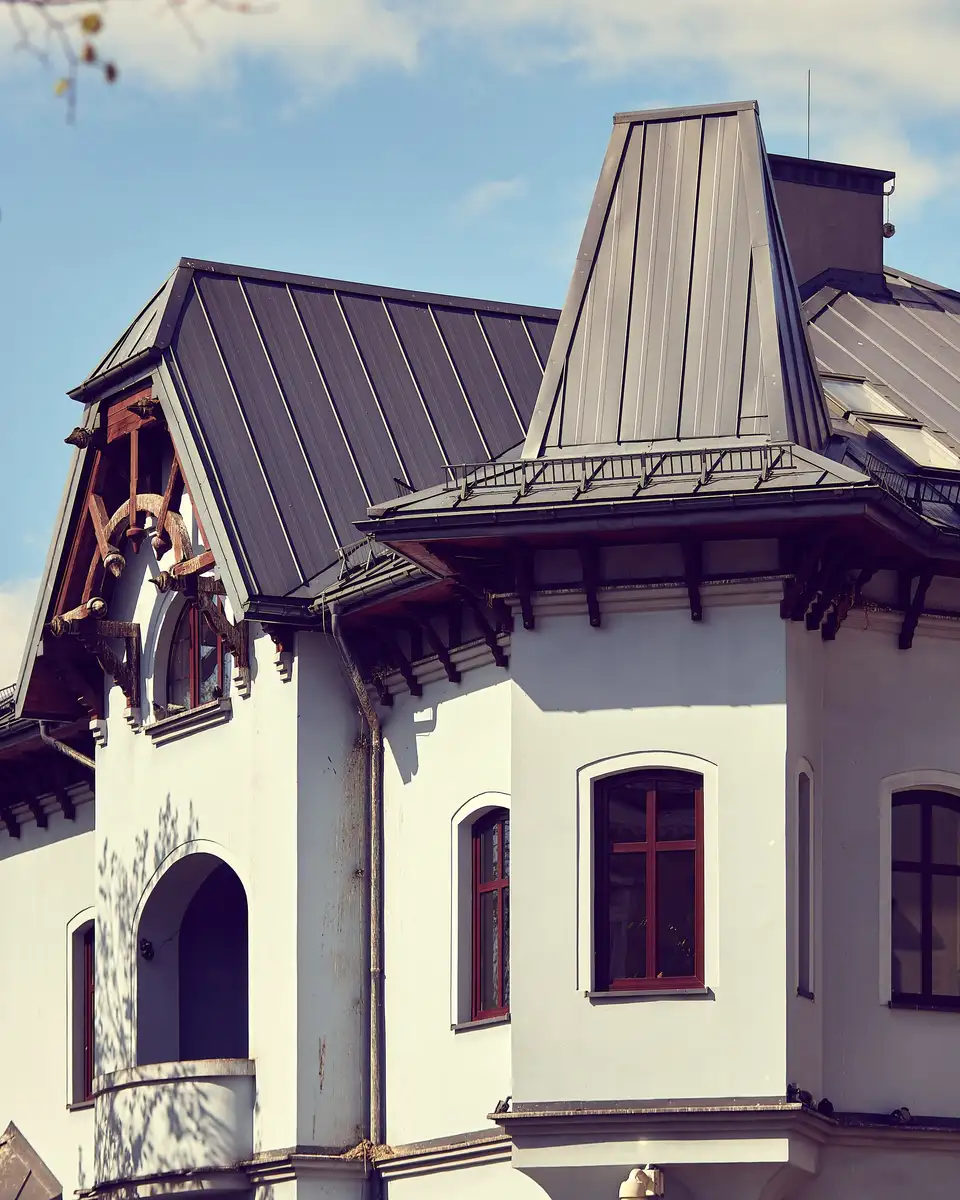 Historic house with a dark standing seam metal roof